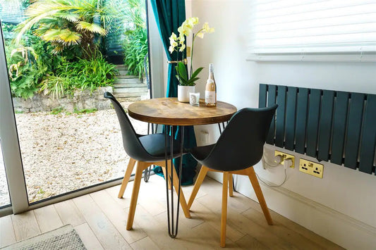 Round rustic dining table - featured in Vogue 2023 - The Grain Company Ltd