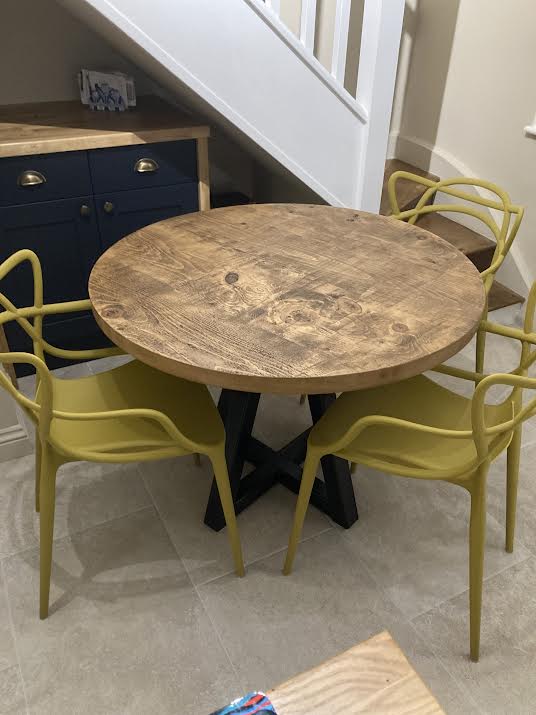 Round rustic dining table with central steel leg - The Grain Company Ltd