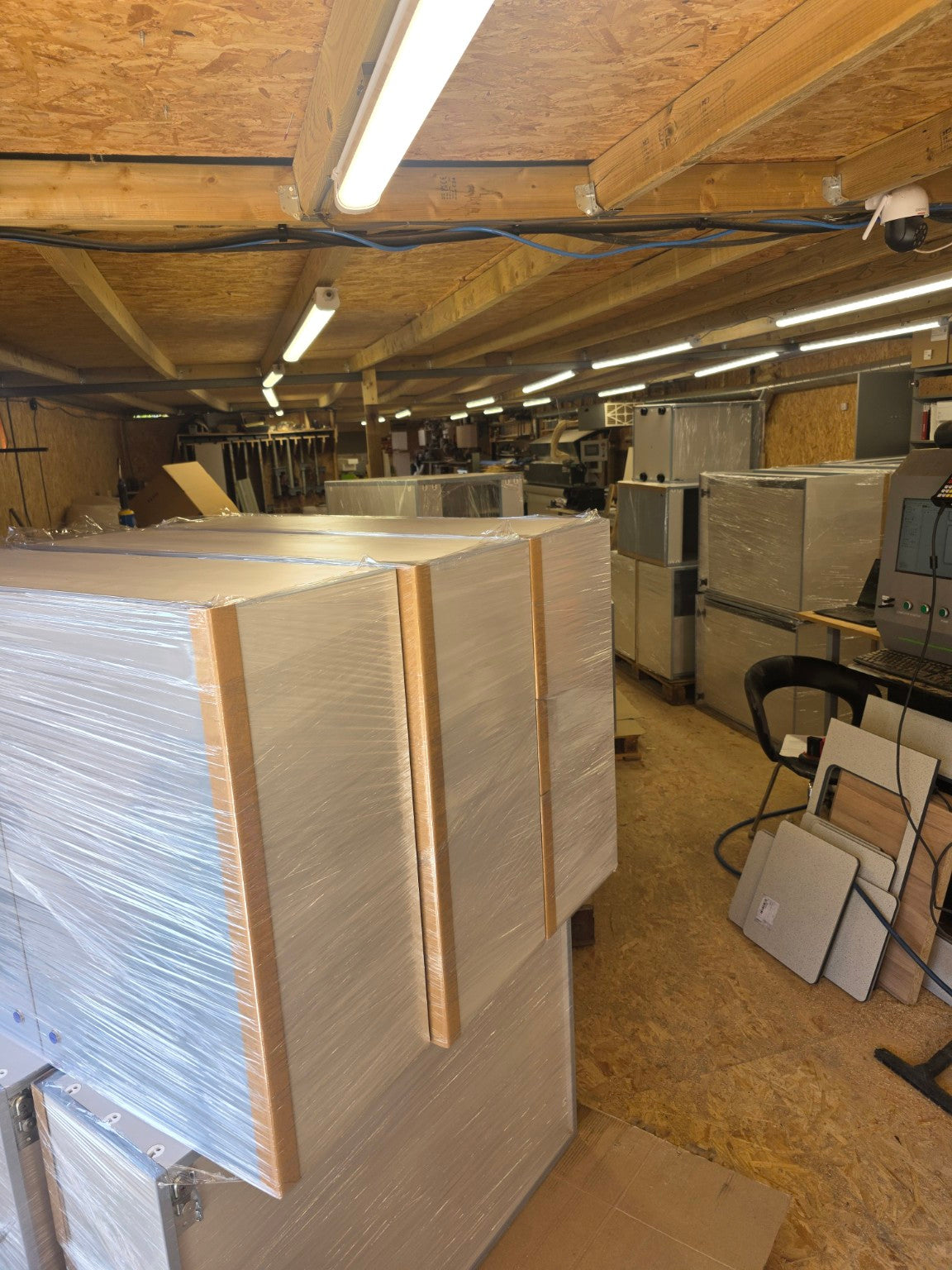 Cabinets wrapped and prepared for delivery in the workshop